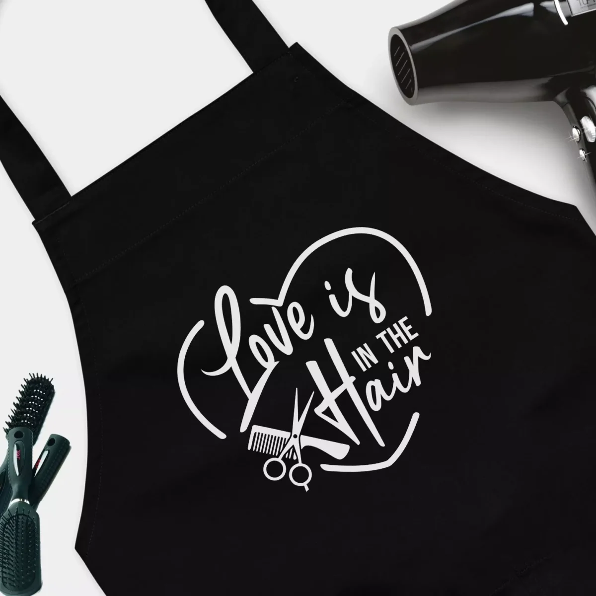 Love is in the Hair Funny Hairstylist Apron - Funny Black Apron for Women And Men - For Hairdressers, Salons, Cosmetology, Perfect Gift for Birthday, Christmas, Valentine's Day
